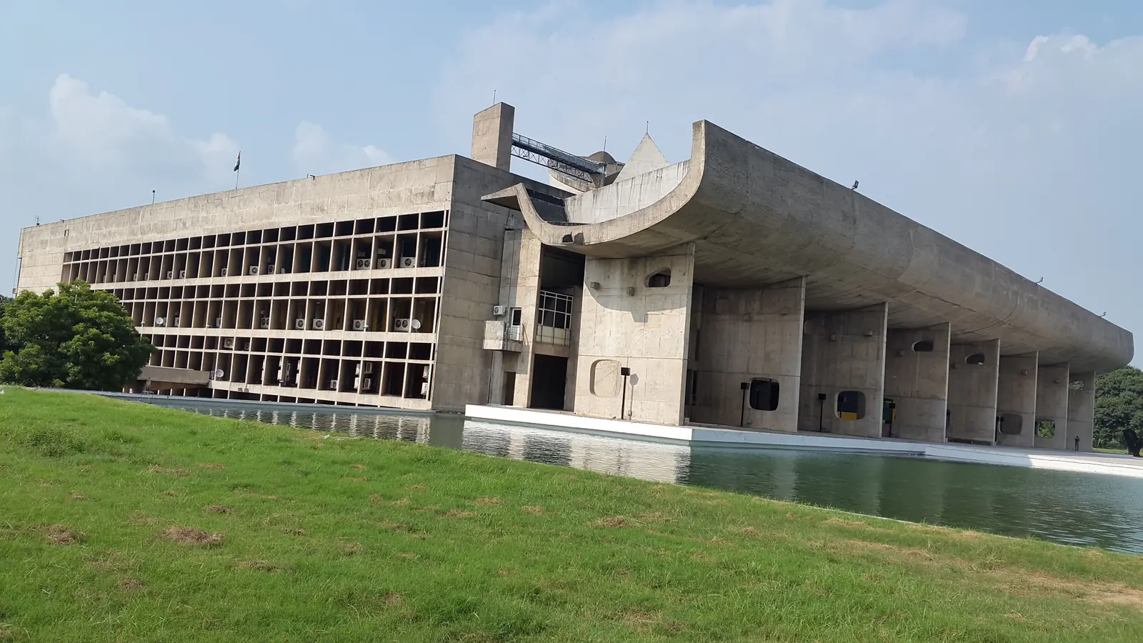 Concrete Palace of Assembly beneath the Chandigarh sky.