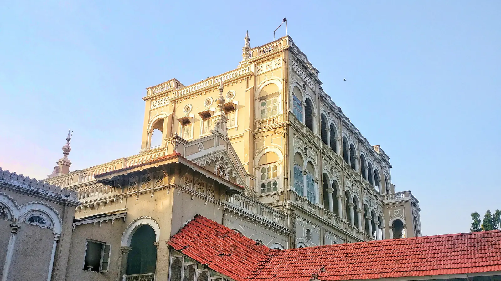 Arched cream facade of Pune's Aga Khan Palace.
