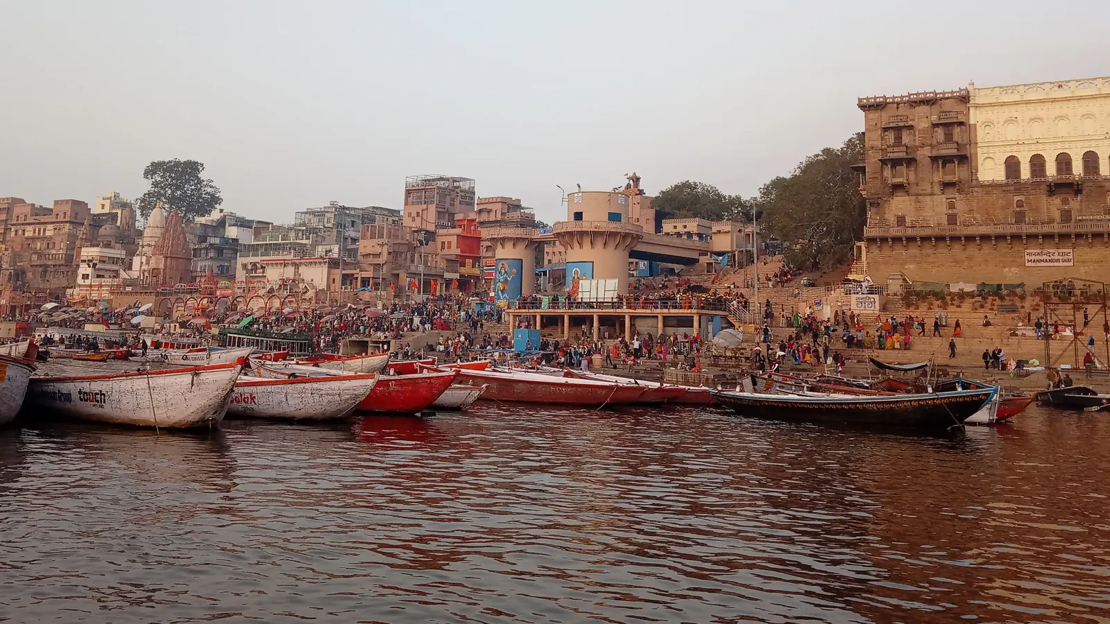 Boats on the Ganges beside Varanasi ghats near Dashashwamedh.