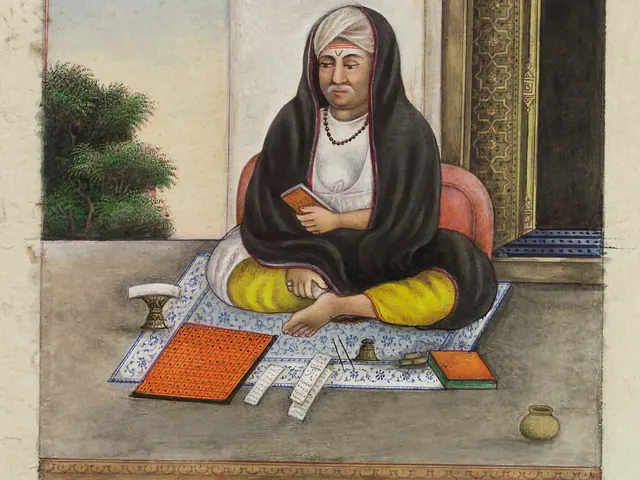 Indian gouache painting from about 1825 showing an unnamed astrologer seated with books and charts